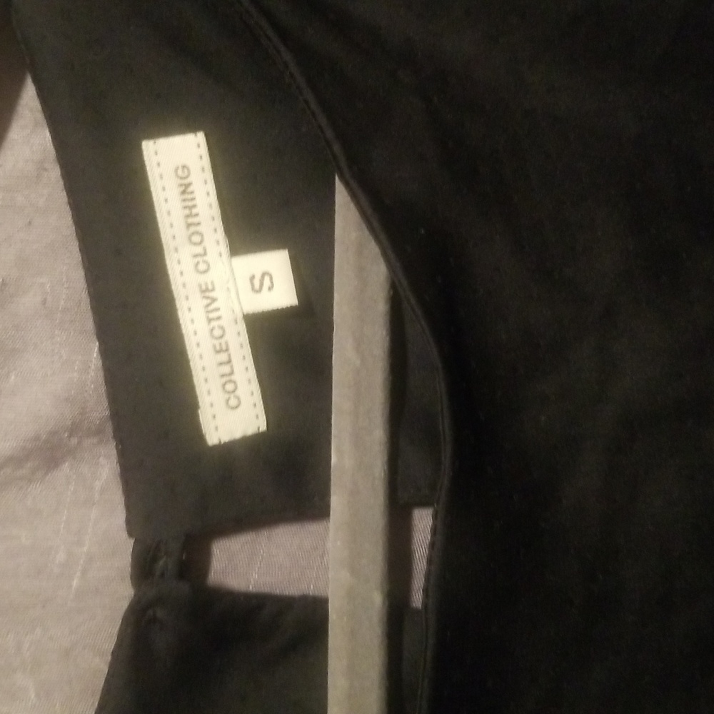 Collective Clothing. Small black dress w/ ruffles and it also ties on the bottom